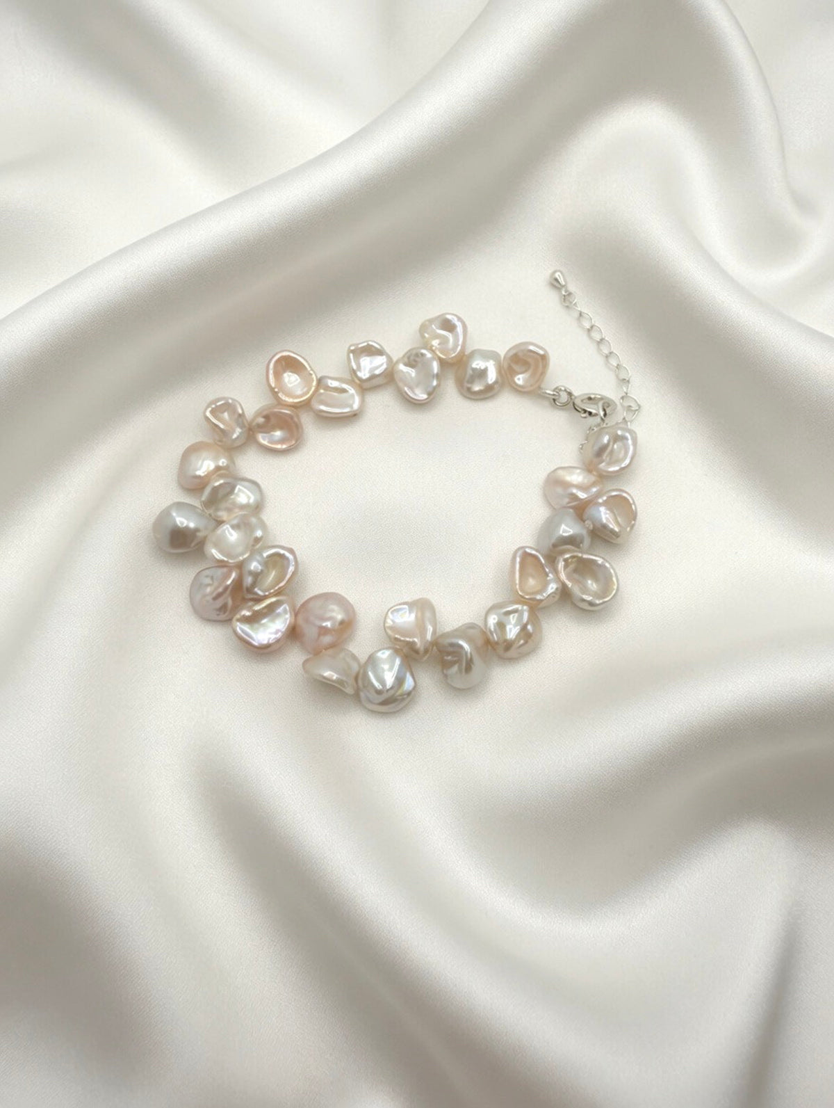 Keshi freshwater pearl sterling silver bracelet — satin flatlay